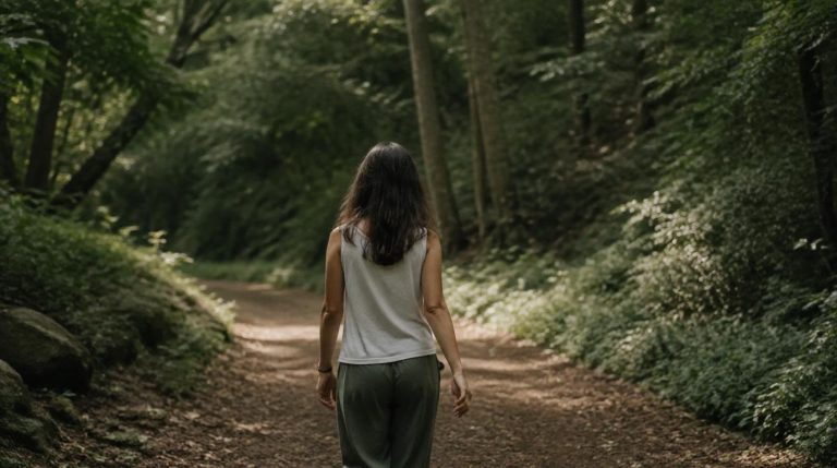 woman walking on a quite forst path